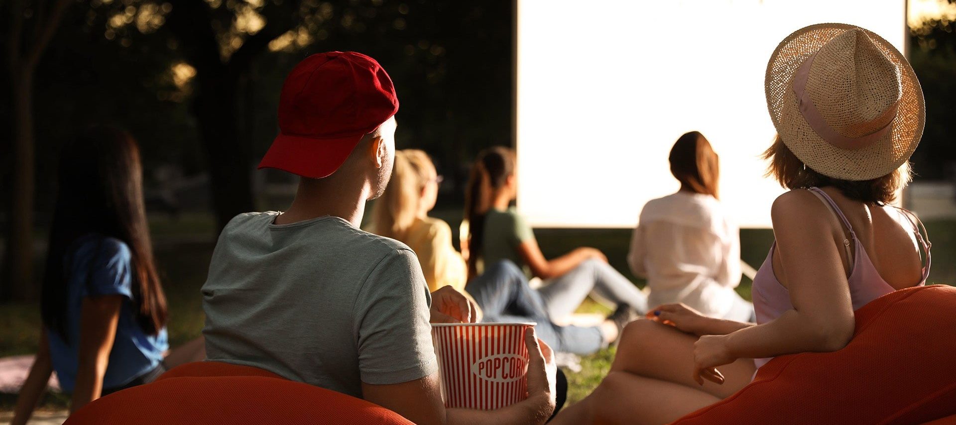 Couple watching open air cinema